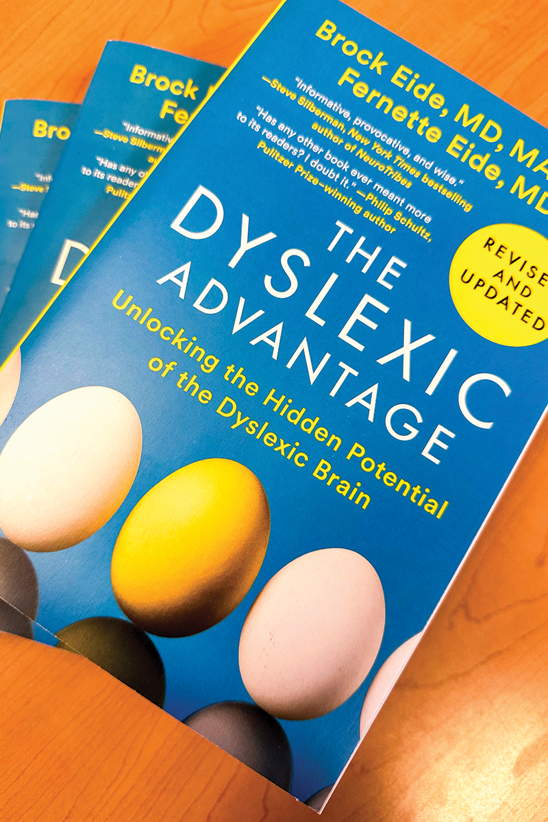 A blue book with the title 'The Dyslexic Advantage' on the front