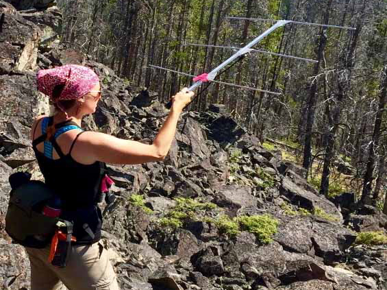 Female student holding a telemetry antenna