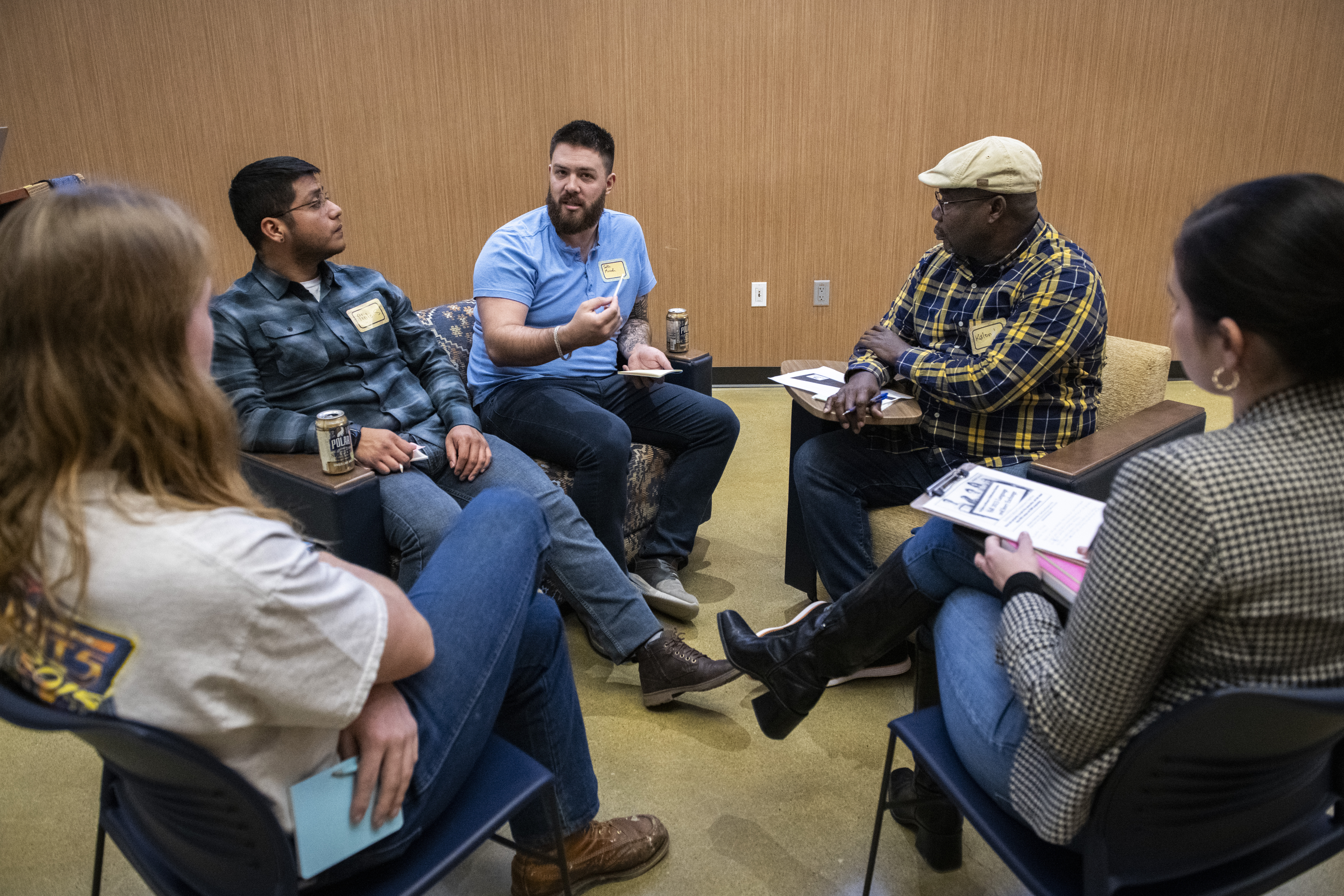 One small group engaged in conversation for 2023 Language and Story Exchange