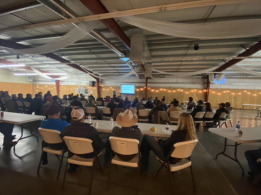 Weed fair attendees listening to Tim Seipel talk about weed management in forages.