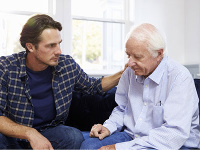 Son comforting father