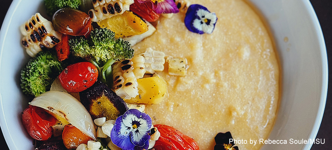 yellow cornmeal grits and roasted vegetables in a bowl