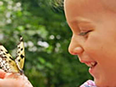 girl with butterfly on her hand