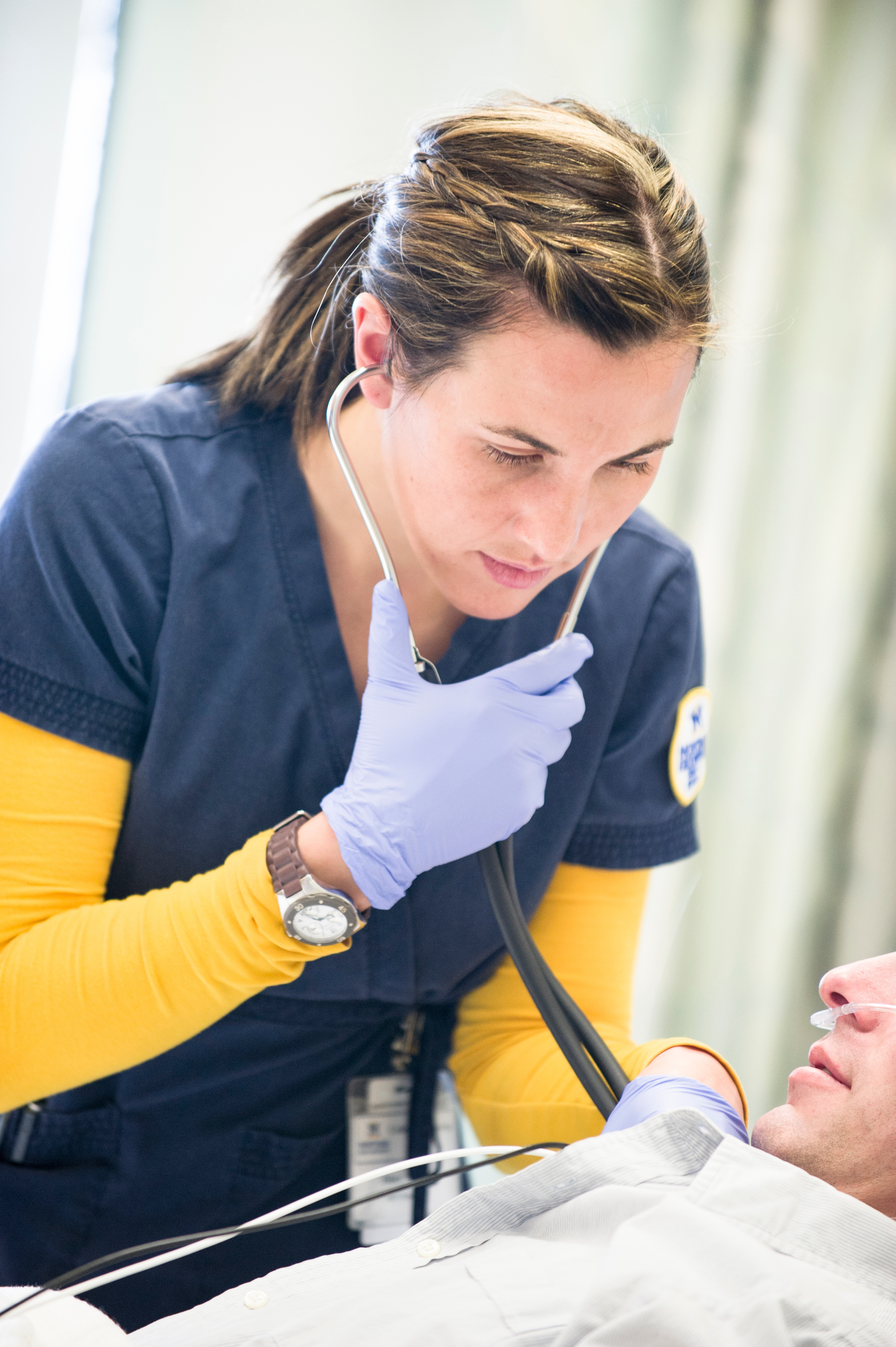 Nurse listening to Heart