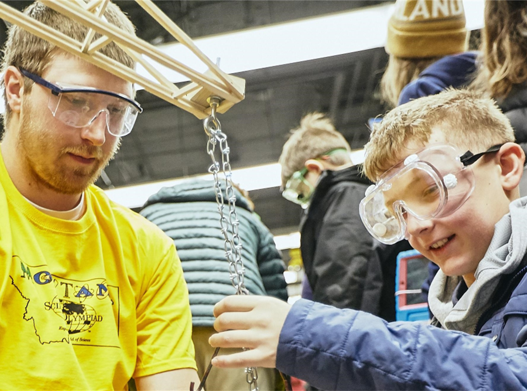 man and boy wearing protective glasses