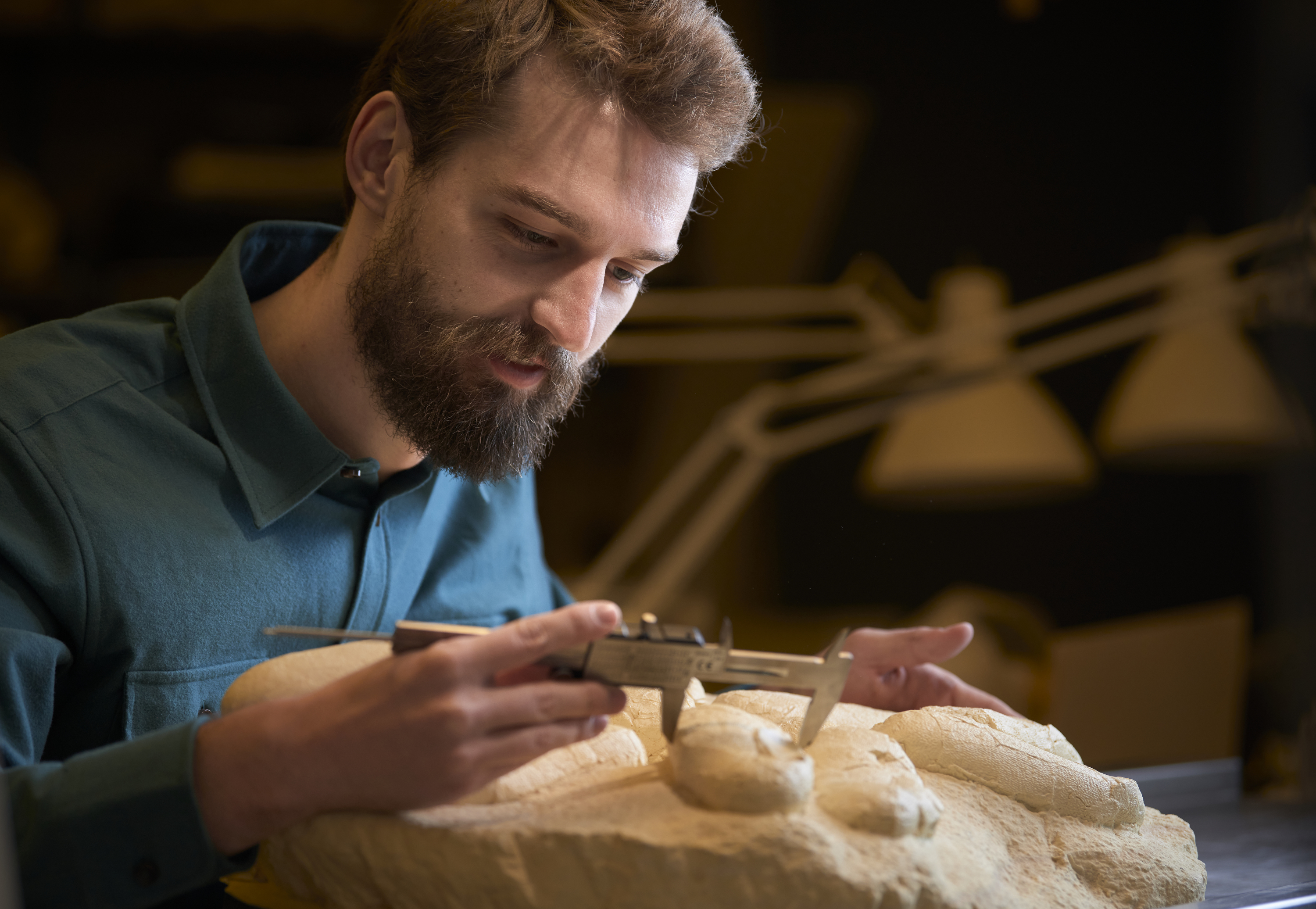 man with dino nest fossil