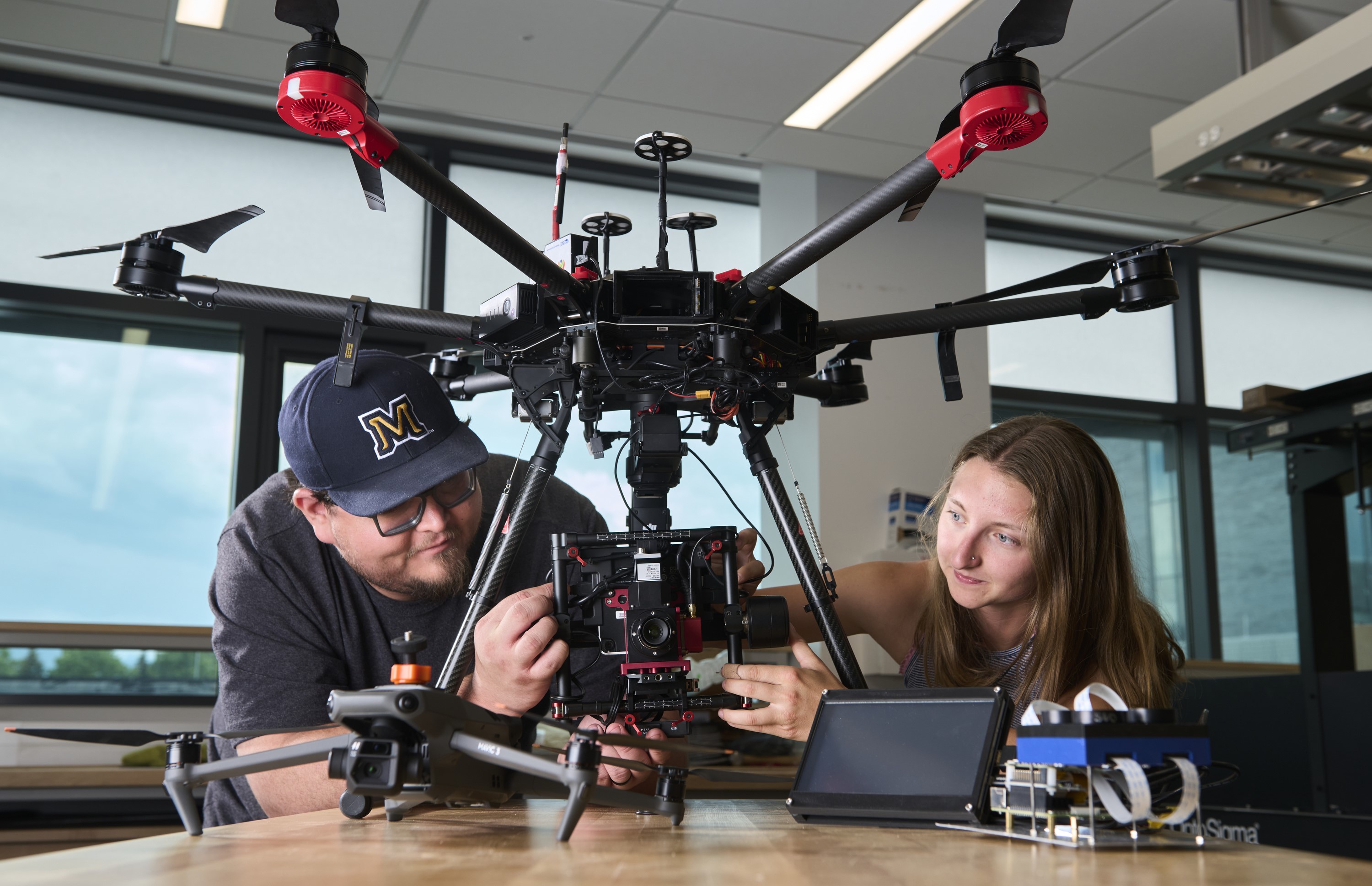 man and woman with drone