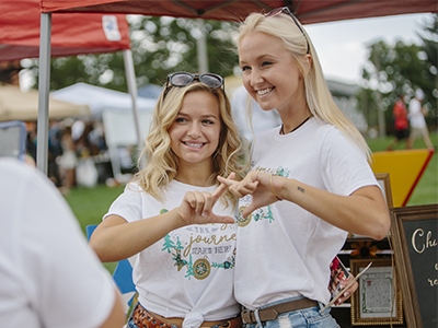 Two sorority members pose for a photo